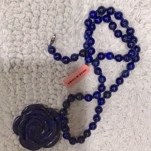 NWT Lapis beaded necklace knotted with flower pendant. 18 inches